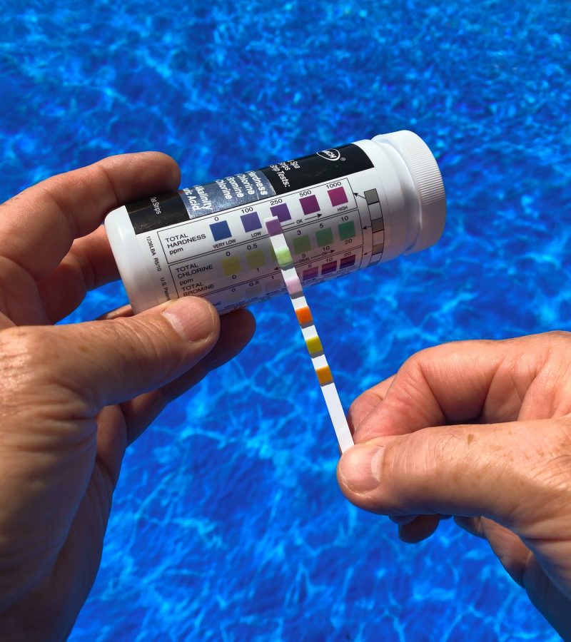 Testing the swimming pool water